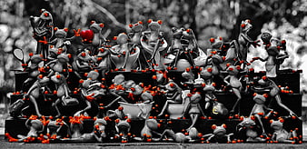 Colorful Frog Figurines on Stairs in Black and White