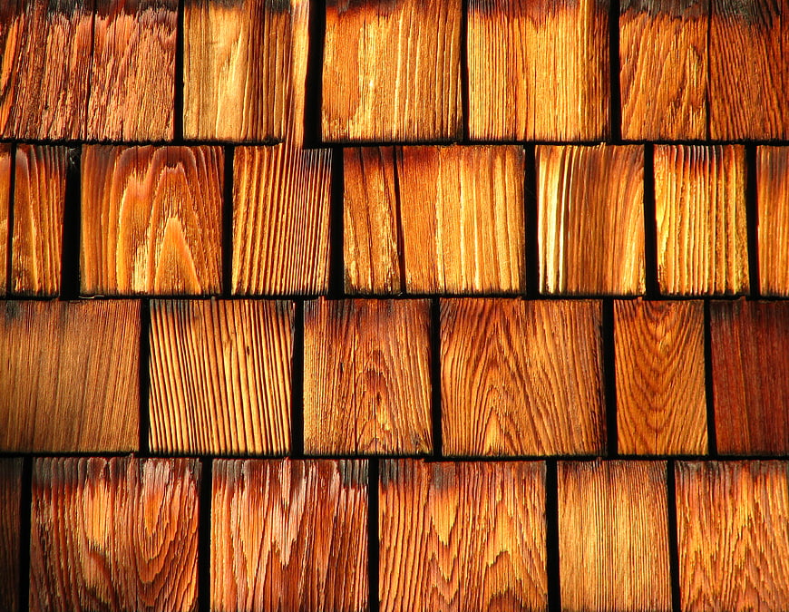 Close-up texture of warm brown wooden shingles