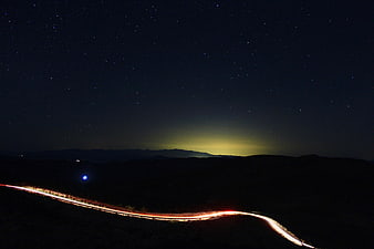 Long Exposure Night Sky with Starry Road Light Trails