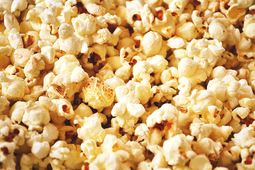 Close-up of fluffy yellow buttered popcorn texture