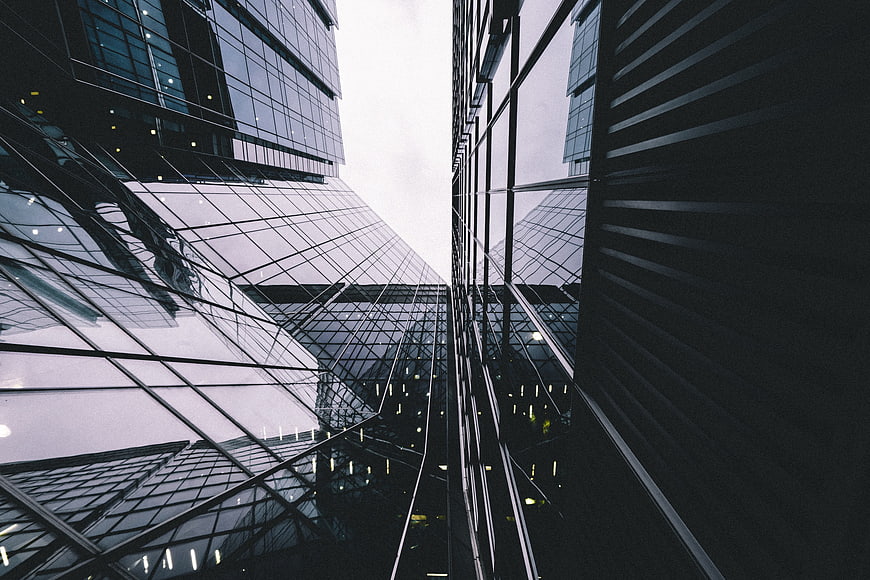 Low angle view of modern glass skyscrapers in a city