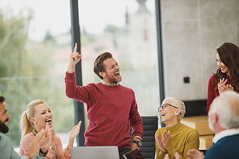 Happy Diverse Team Celebrating Success in Modern Office