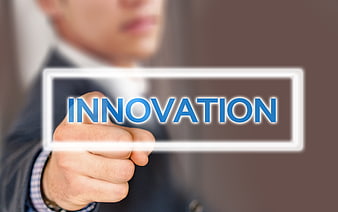 Businessman touching innovation button on digital interface