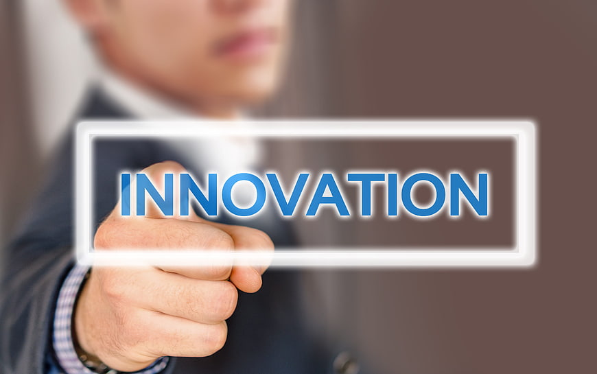 Businessman touching innovation button on digital interface