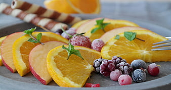 Fresh Fruit Platter With Oranges, Apples, And Frozen Berries