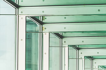 Abstract Green Glass Architecture with Geometric Patterns