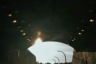 View from Under a Concrete Overpass Tunnel with Street Lights