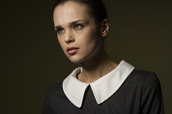 Studio Portrait Of Young Woman With White Collar