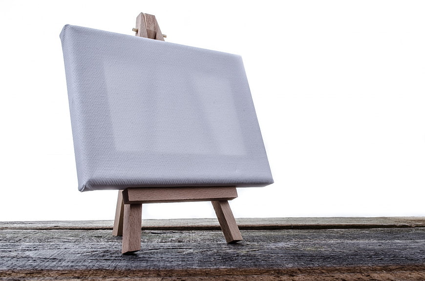 Blank Canvas on Wooden Easel with White Background