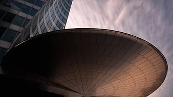 Low Angle View of Modern Satellite Dish and Glass Building