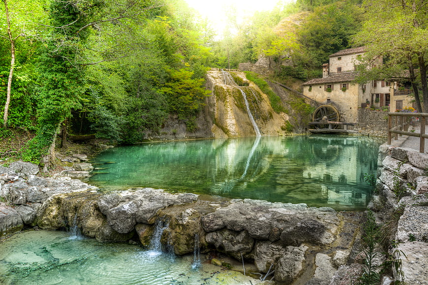 Historic Watermill with Turquoise Pool in Italian Countryside