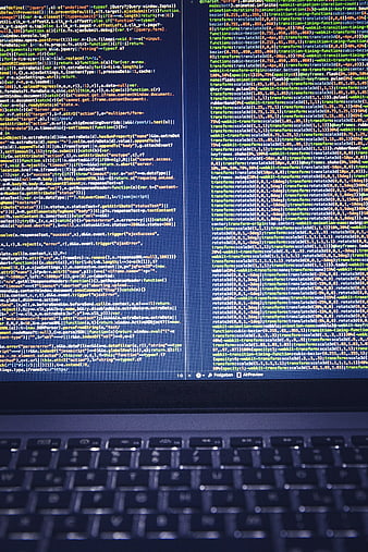 Computer screen displaying lines of code with blurred keyboard