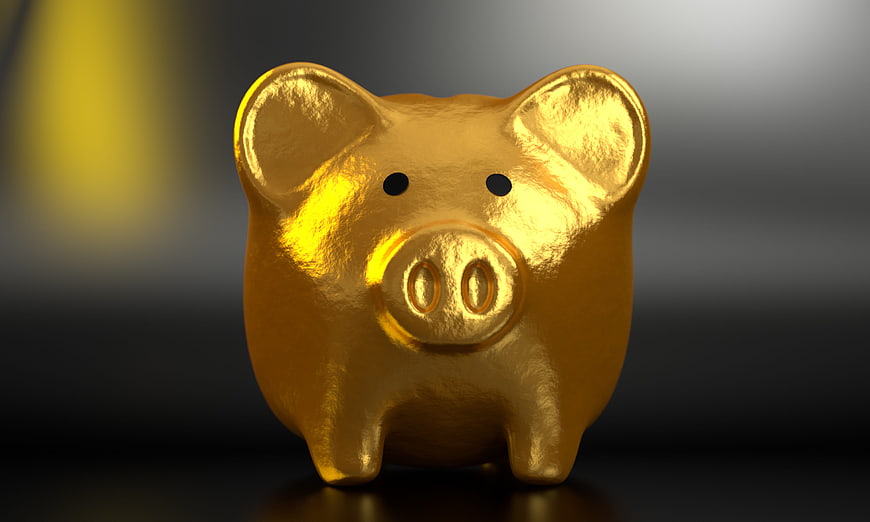 Golden Piggy Bank on Dark Background