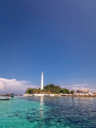 Tropical Lighthouse on Pulau Lengkuas Island with Turquoise Water
