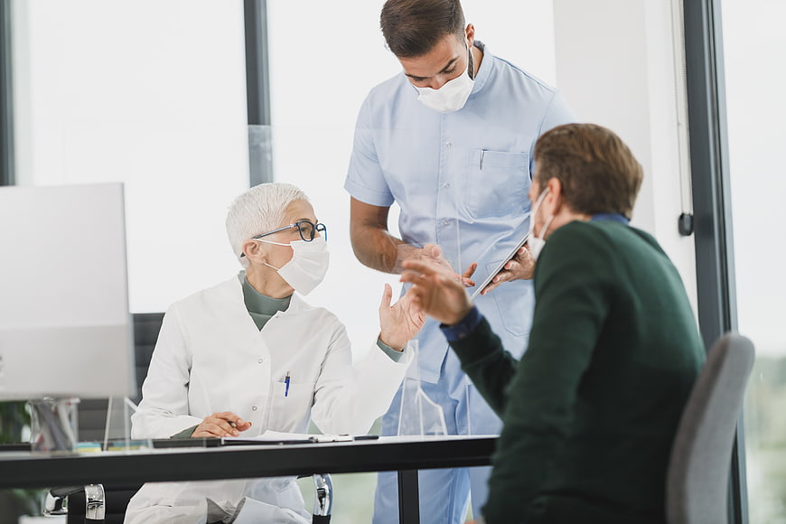 Medical team discussing patient care in modern clinic