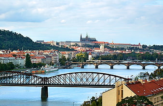 Panoramic view of Prague skyline with Vltava River and bridges