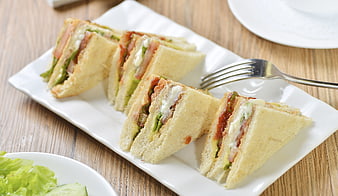 Fresh Club Sandwiches With Lettuce And Tomato On White Plate