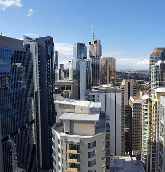 Brisbane City Skyline with Modern Skyscrapers and Blue Sky