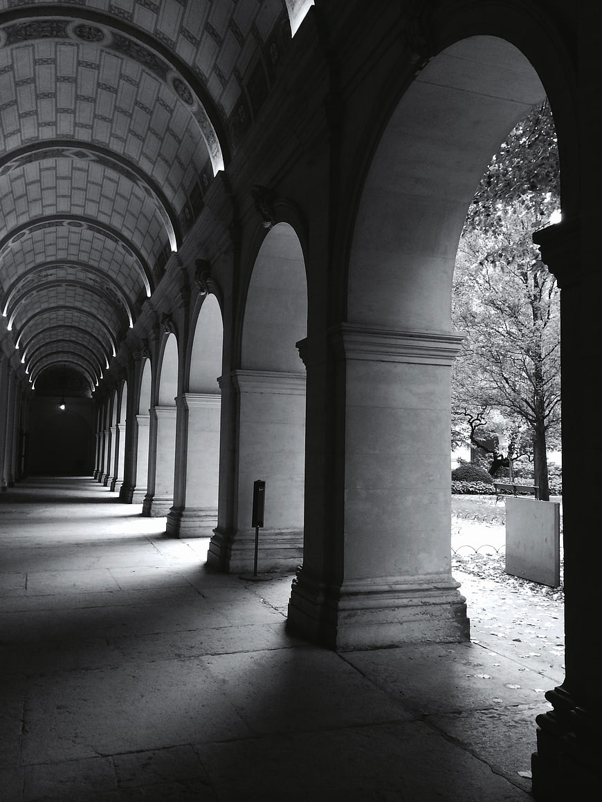 Black and white perspective of a grand arched colonnade