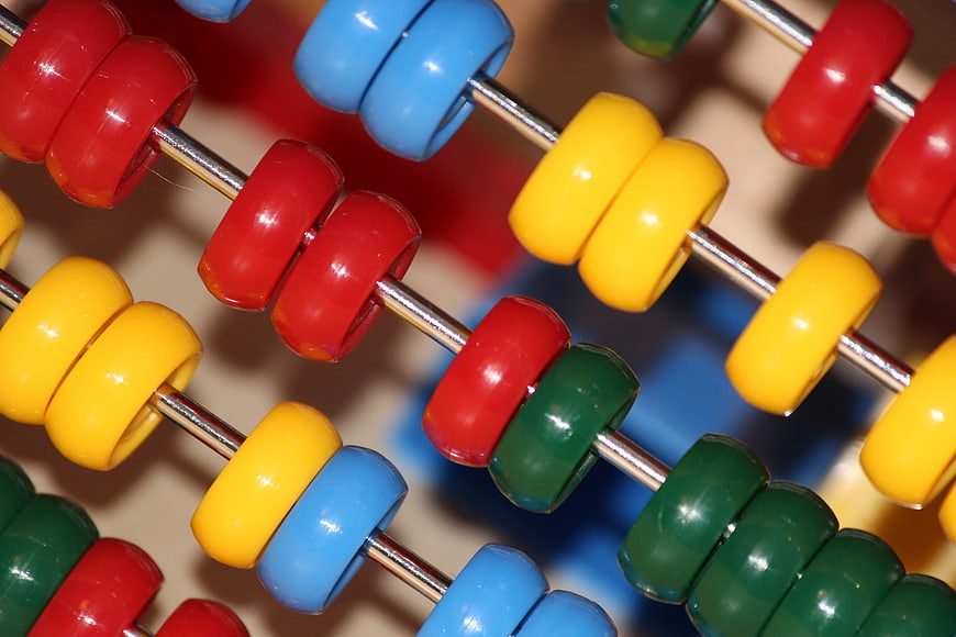 Close-up of colorful plastic abacus beads for education