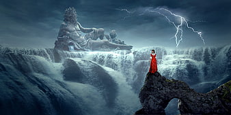 Woman in Red Dress Standing on Cliff Near Waterfall and Statue