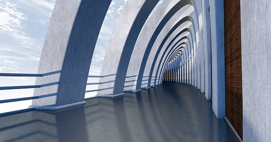 Modern concrete corridor with arches and brick wall