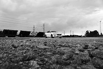 White Renault Talisman on Gravel Railway Yard