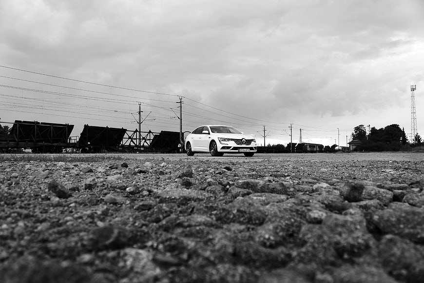 White Renault Talisman on Gravel Railway Yard
