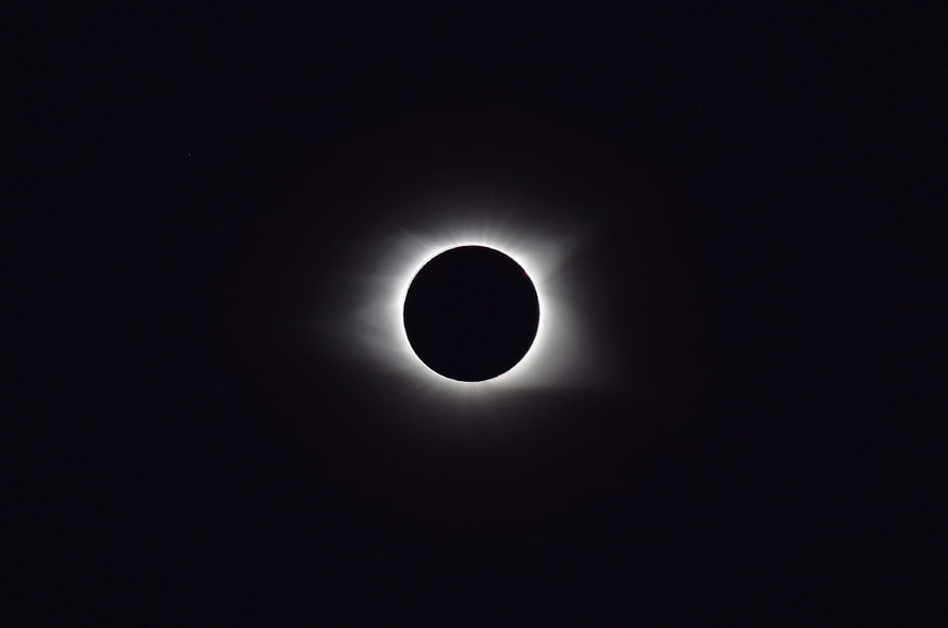 Total Solar Eclipse with Visible Corona in Dark Sky