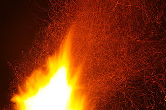 Dynamic Fire Sparks and Flames on Black Background