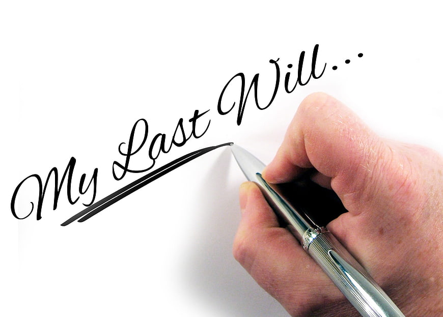 Hand writing My Last Will with silver pen on white paper