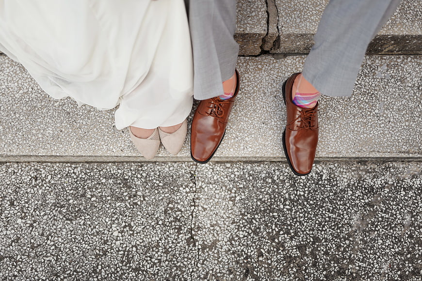 Top View of Wedding Couple Feet on Concrete Steps