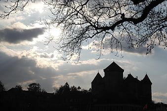 Silhouette of Chateau d'Annecy Against Dramatic Cloudy Sky