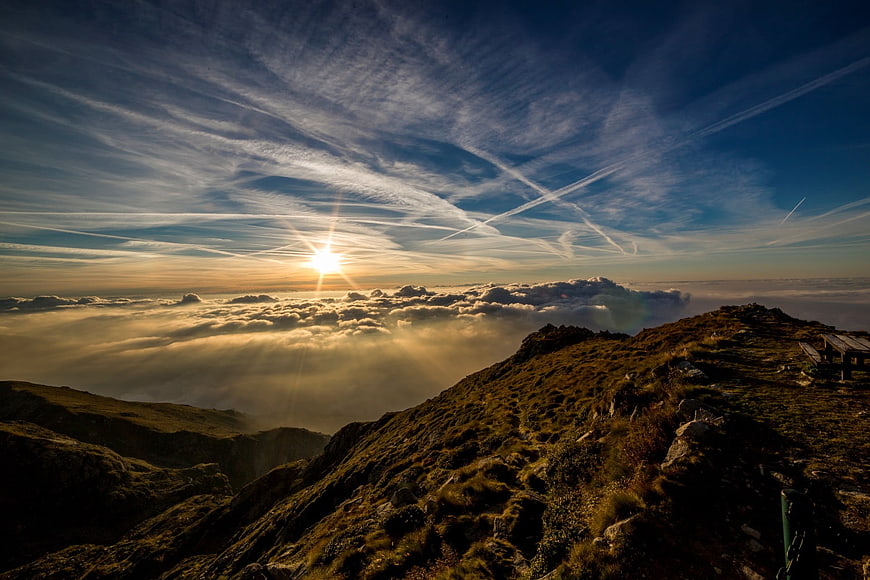 Sunrise Over Mountain Peak With Sea of Clouds