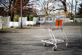 Lonely Shopping Cart in Empty Parking Lot
