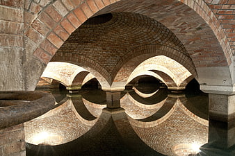 Symmetrical Brick Arches Reflected in Water