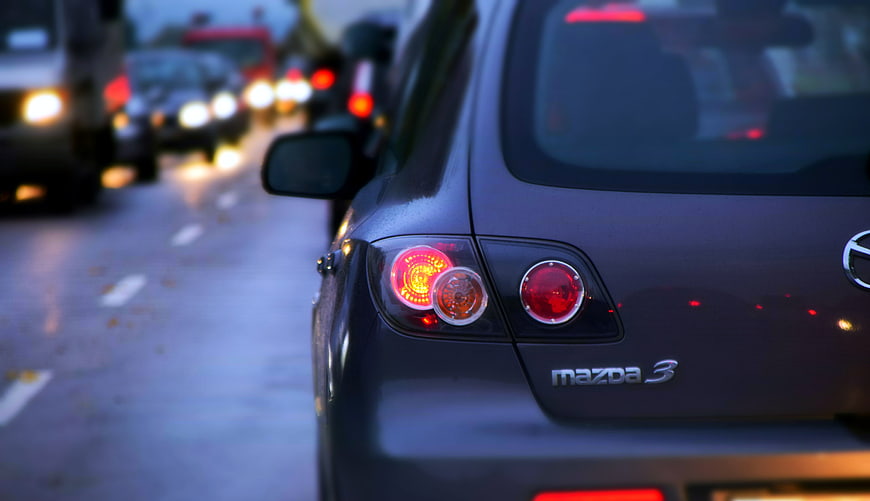 Close-up of Mazda 3 Taillights in Evening Traffic Jam