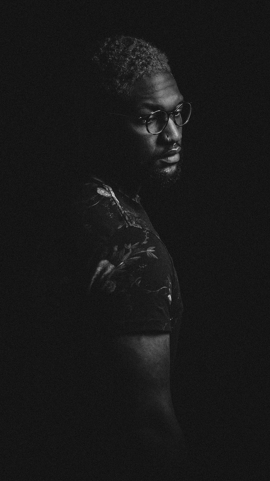 Dramatic Black and White Portrait of Man with Glasses
