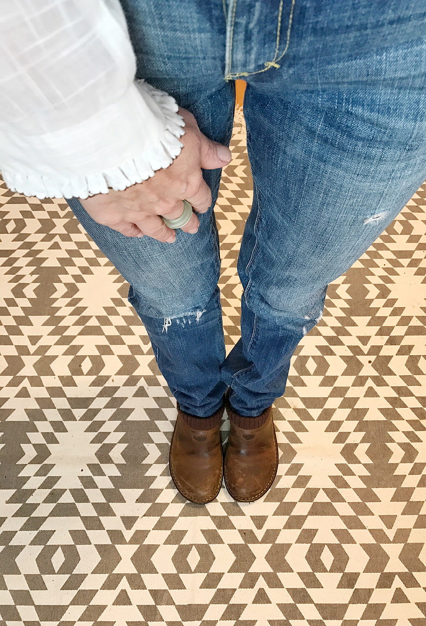 Woman in Jeans and Boots on Patterned Floor