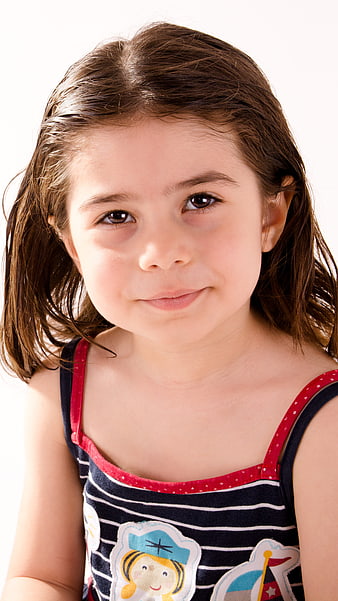 Portrait of a smiling young girl with brown hair