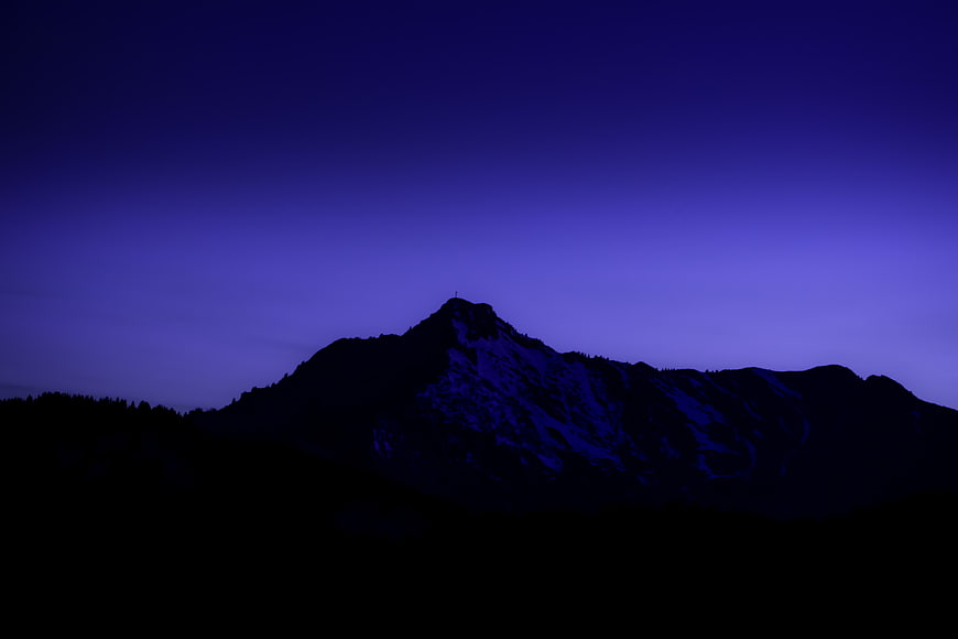 Silhouette of Mountain Peak Against Purple Twilight Sky