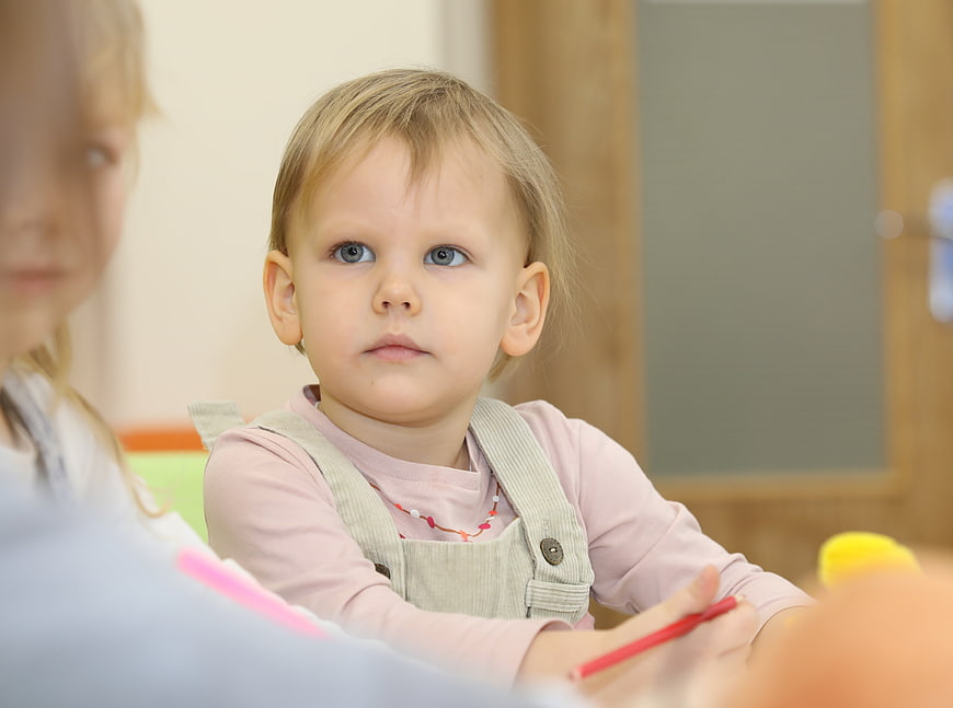 Cute Toddler Girl in Kindergarten Class