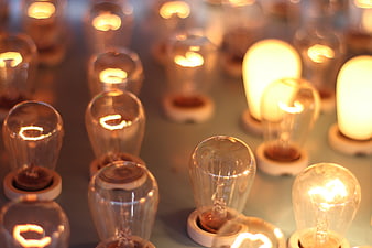 Close-up of vintage light bulbs glowing on a surface