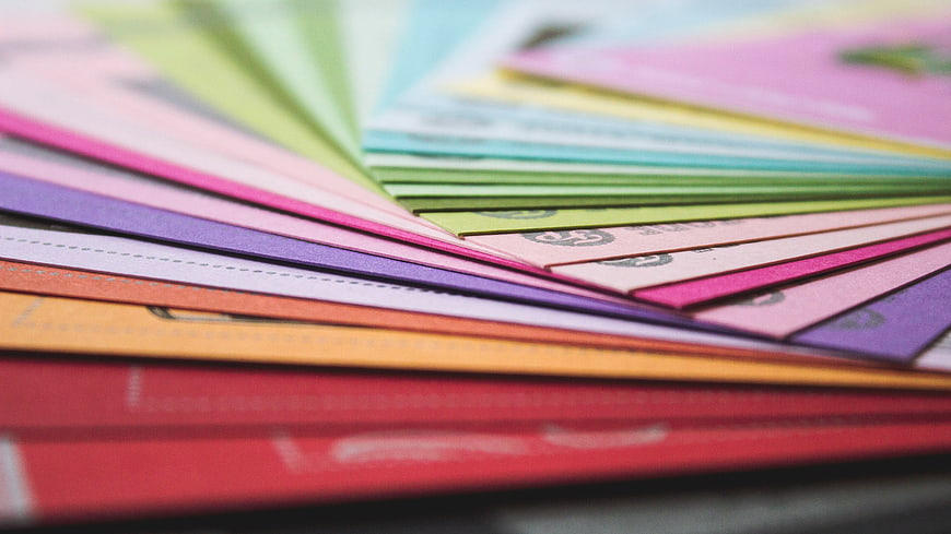 Close-up of colorful paper swatches fanned out