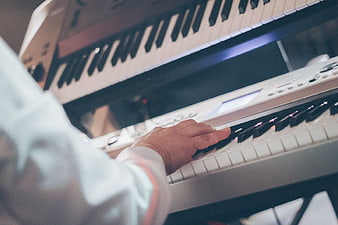 Close-up of musician playing electronic keyboard