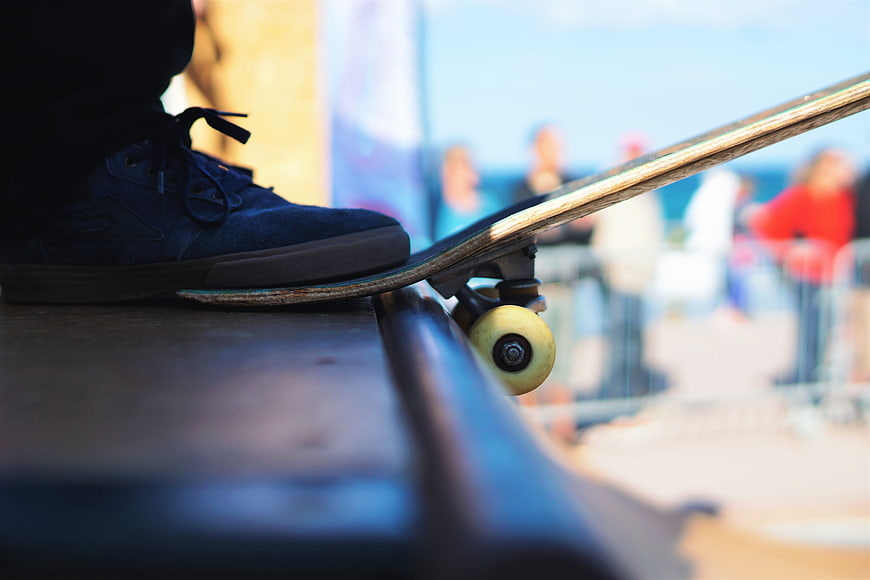 Close-up of Skateboard Foot on Rail