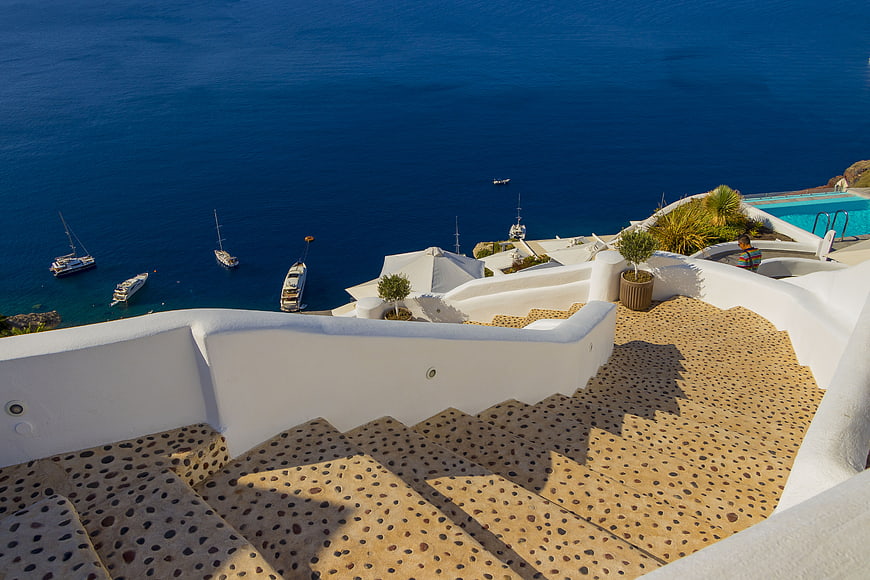 White Staircase Overlooking Blue Aegean Sea in Santorini