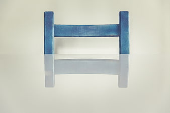 Blue Wooden H-Shaped Object on White Background