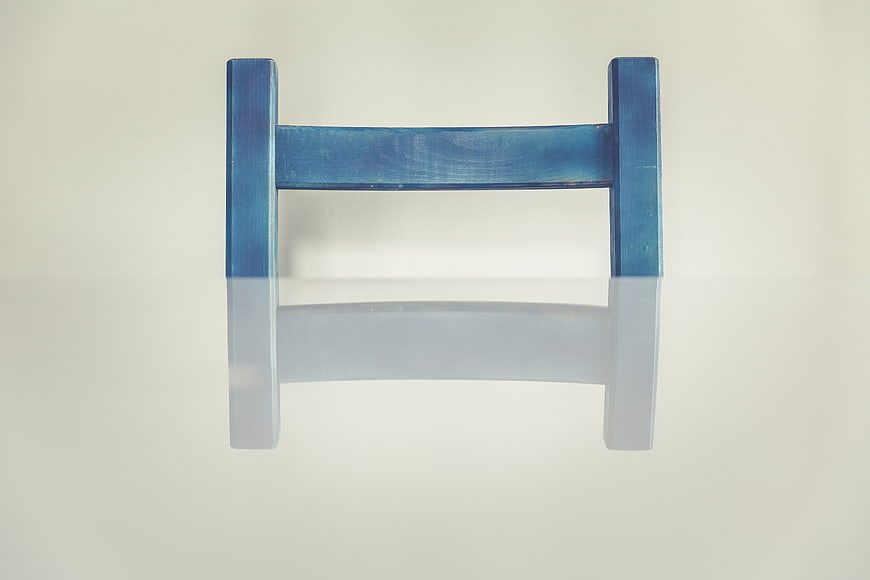 Blue Wooden H-Shaped Object on White Background