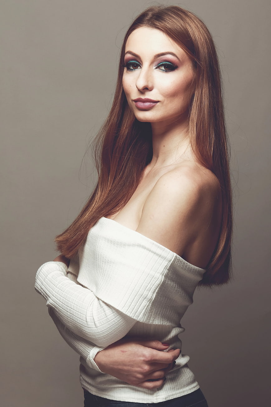 Portrait of Woman with Blue Eyeshadow in White Top
